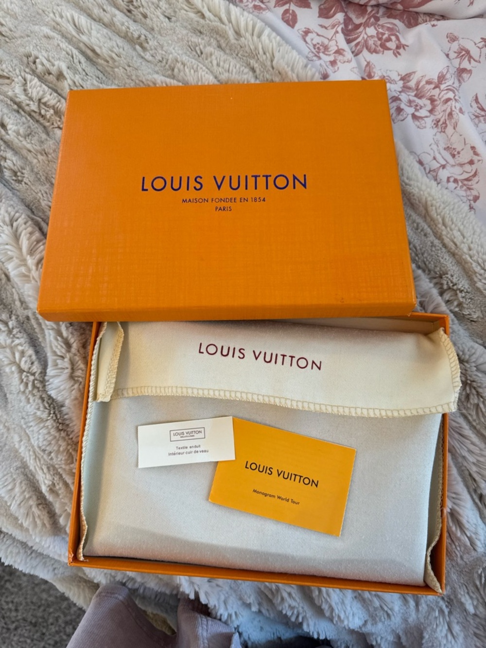 LOUIS VUITTON red pouch wallet with authenticator.